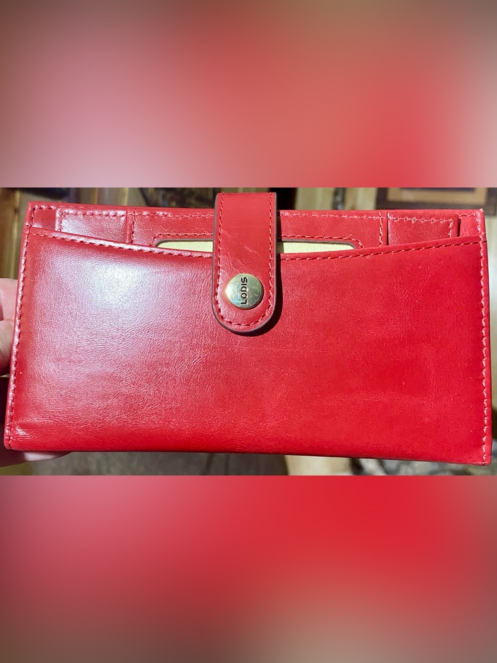 Lodis Women's Leather Wallet with a red finish and a snap button clasp